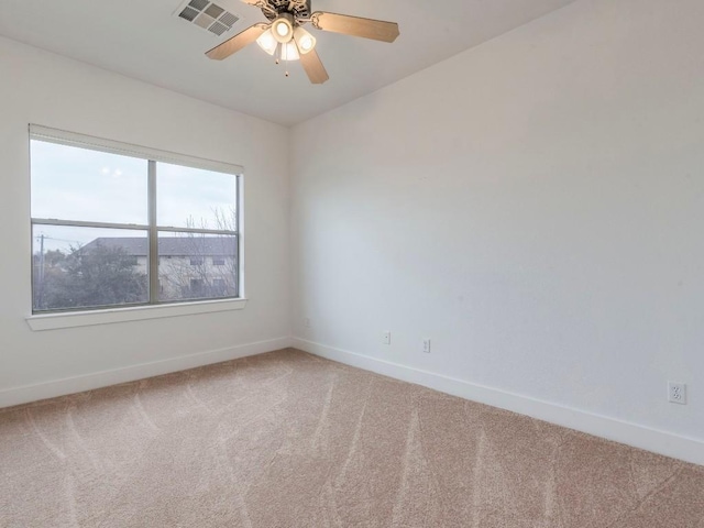 unfurnished room with carpet flooring and ceiling fan