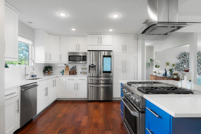 kitchen with sink, appliances with stainless steel finishes, island exhaust hood, white cabinets, and blue cabinets