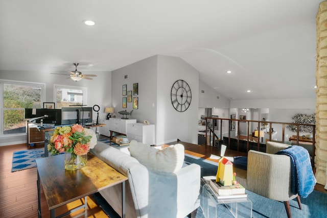 living room with hardwood / wood-style flooring, vaulted ceiling, and ceiling fan