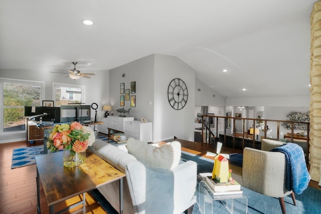 living room with ceiling fan, lofted ceiling, and hardwood / wood-style floors