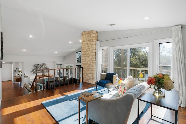 living room with dark hardwood / wood-style floors and vaulted ceiling