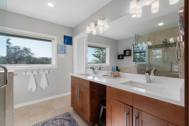 bathroom with vanity, tile patterned floors, and a shower with door