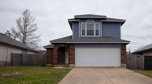 view of property featuring a front lawn and a garage