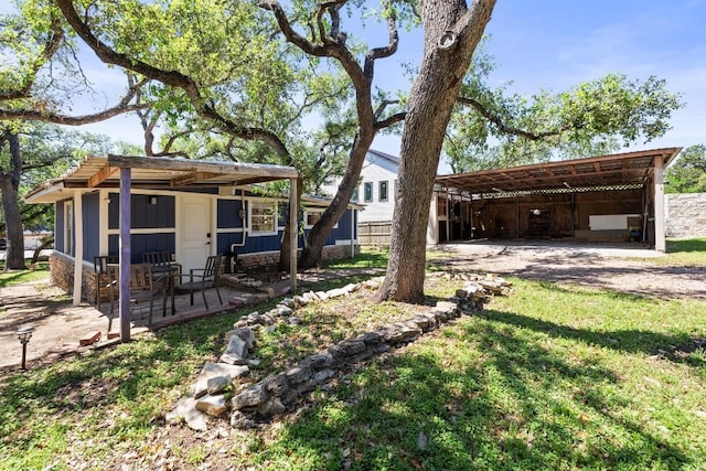 view of yard with a carport