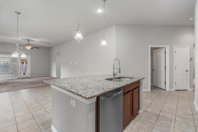 kitchen featuring dishwasher, a kitchen island with sink, sink, ceiling fan, and decorative light fixtures