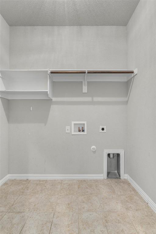 laundry area featuring electric dryer hookup, gas dryer hookup, and washer hookup