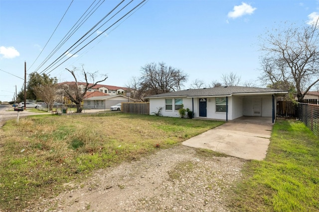 307 E Powell Ln, Austin, TX 78753 - ranch-style house featuring a front lawn and a carport