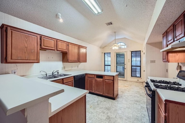 kitchen with gas range gas stove, sink, ceiling fan, black dishwasher, and kitchen peninsula