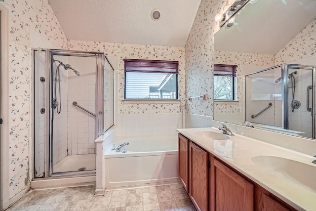 bathroom with lofted ceiling, vanity, a textured ceiling, and shower with separate bathtub