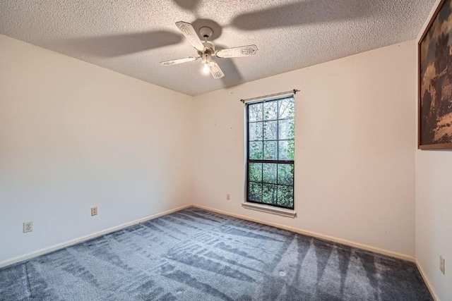 carpeted empty room featuring a textured ceiling and ceiling fan