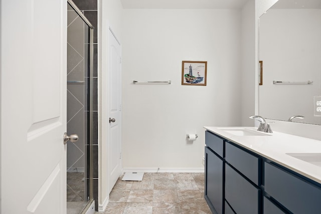 bathroom with vanity and an enclosed shower