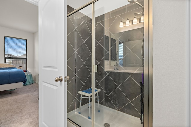 bathroom featuring a shower with shower door