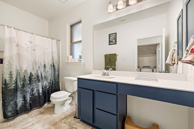 bathroom featuring vanity and toilet