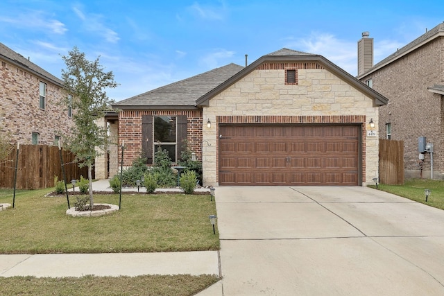 4429 Venticano Pl, Round Rock, TX 78665 - french country home with a garage, driveway, a shingled roof, stone siding, and brick siding