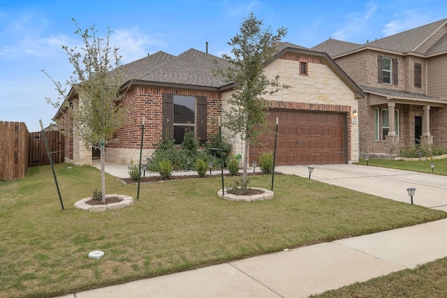 view of front of home with a front lawn and a garage