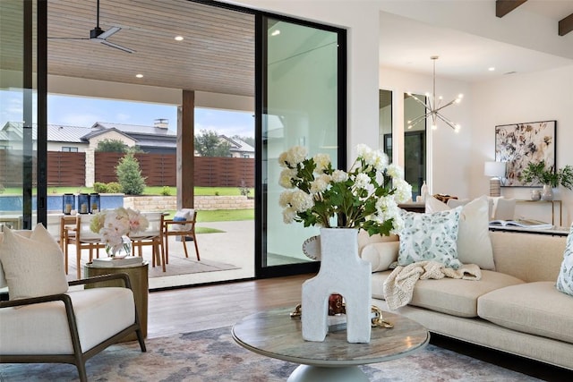 entryway with hardwood / wood-style floors, ceiling fan with notable chandelier, and wood ceiling