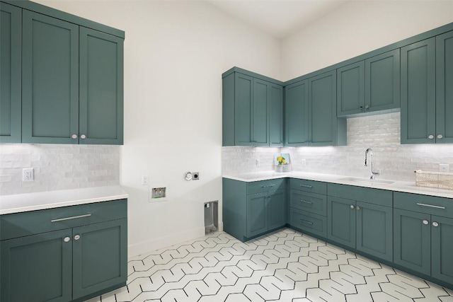 17212 Morning Grove Ln, Austin, TX 78738 - laundry room with electric dryer hookup, washer hookup, cabinet space, and baseboards