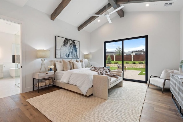 bedroom with ensuite bathroom, beam ceiling, wood-type flooring, and access to outside