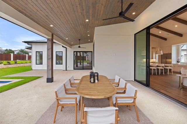 view of patio featuring a ceiling fan and outdoor dining space