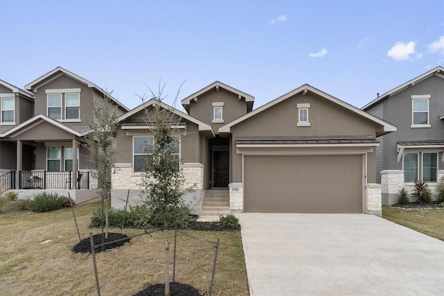 craftsman house featuring a garage and a front yard