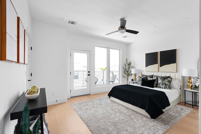 bedroom with access to exterior, light hardwood / wood-style flooring, and ceiling fan