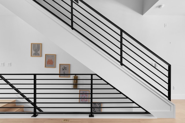 stairs with wood-type flooring