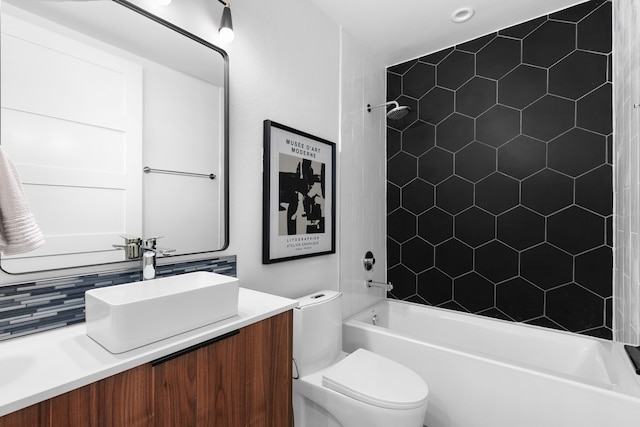 full bathroom featuring vanity, toilet, bathing tub / shower combination, and decorative backsplash