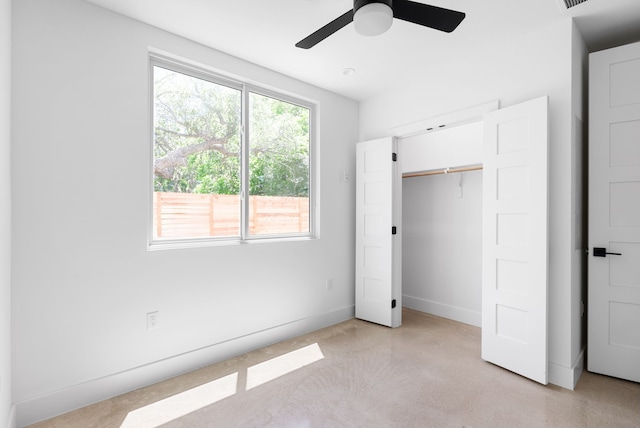 unfurnished bedroom with a closet and ceiling fan