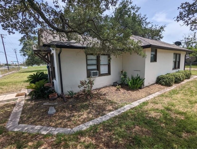 view of property exterior with a yard