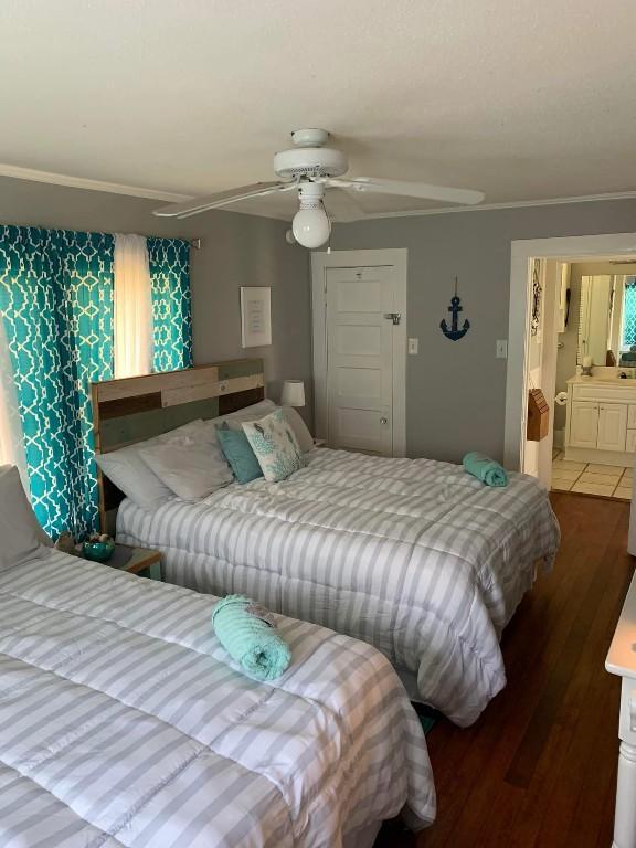 bedroom featuring hardwood / wood-style floors and ceiling fan