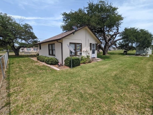 view of side of property featuring a lawn