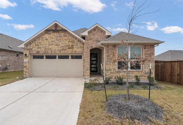 view of front property featuring a front lawn and a garage