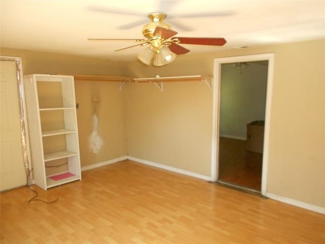 unfurnished bedroom with hardwood / wood-style floors and ceiling fan