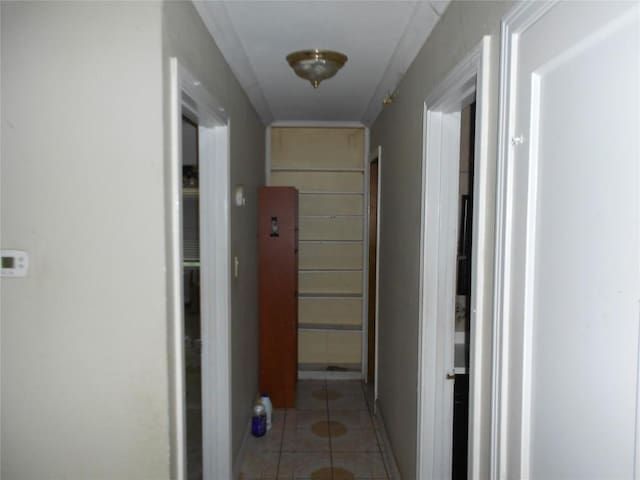 corridor with light tile patterned floors