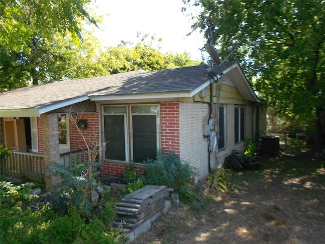 view of home's exterior with central AC unit