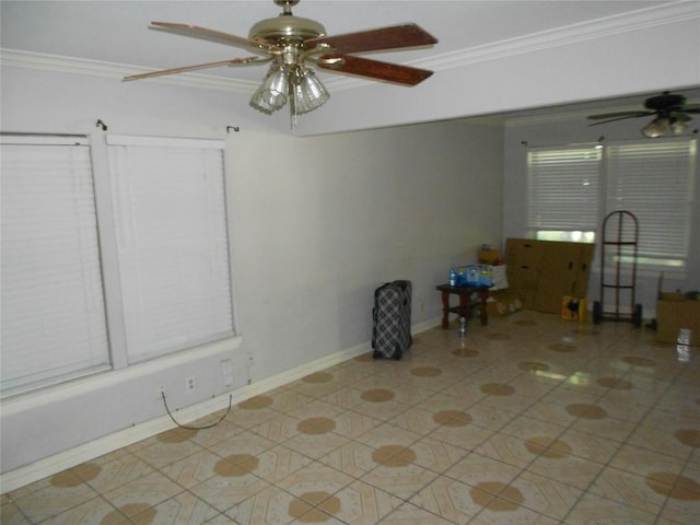 tiled empty room featuring crown molding and ceiling fan