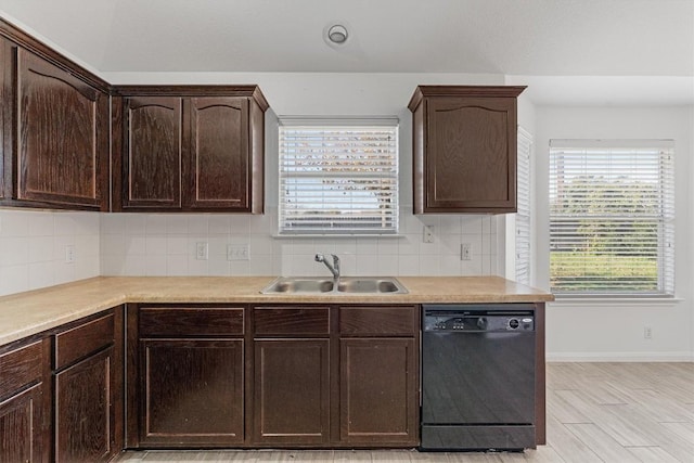 kitchen with dishwasher, sink, light hardwood / wood-style flooring, decorative backsplash, and dark brown cabinets