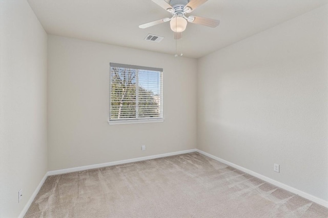 spare room with light colored carpet