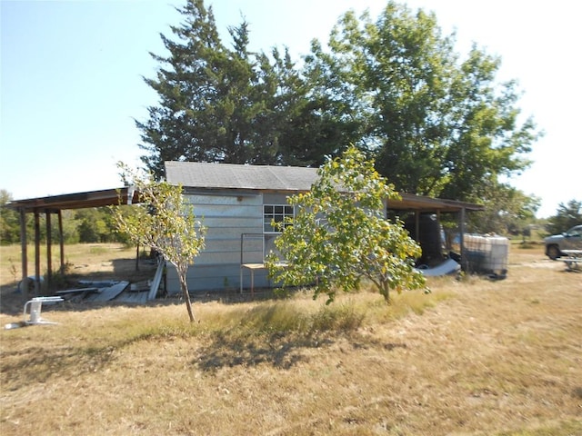 377 Crooked Rd, Dale, TX 78616 - rear view of property featuring a carport