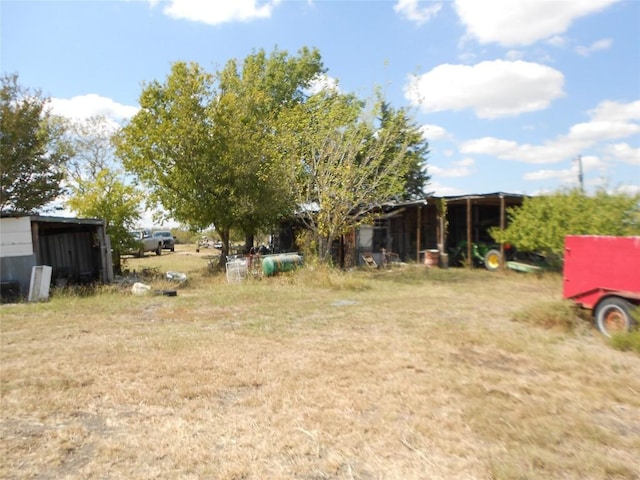 377 Crooked Rd, Dale, TX 78616 - view of yard with an outbuilding
