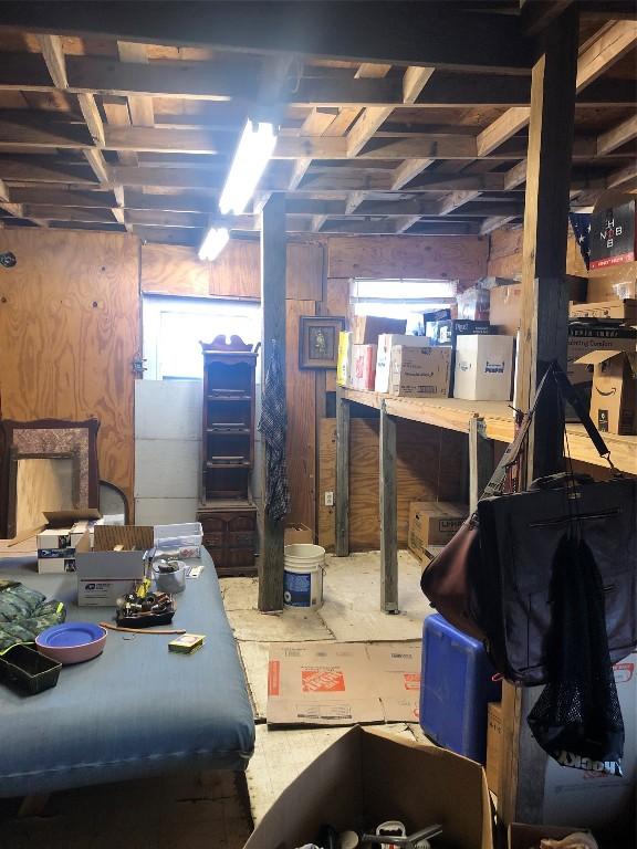 377 Crooked Rd, Dale, TX 78616 - basement featuring wooden walls