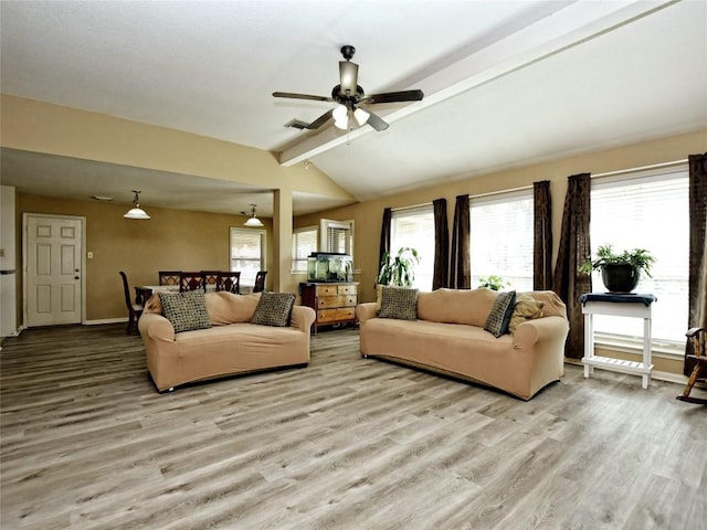 living room featuring light wood-type flooring, lofted ceiling with beams, and ceiling fan