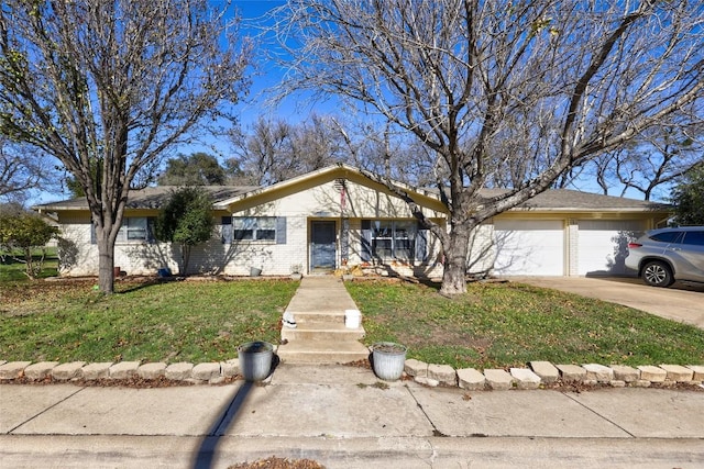 ranch-style home featuring a front lawn and a garage