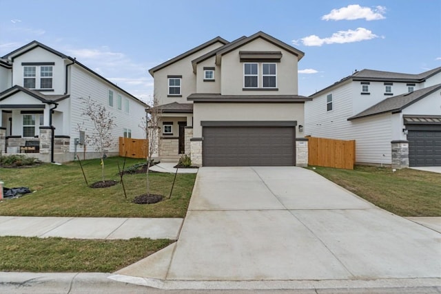 view of front of property featuring a garage and a front lawn