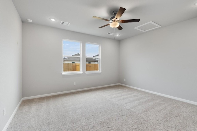 unfurnished room with carpet and ceiling fan