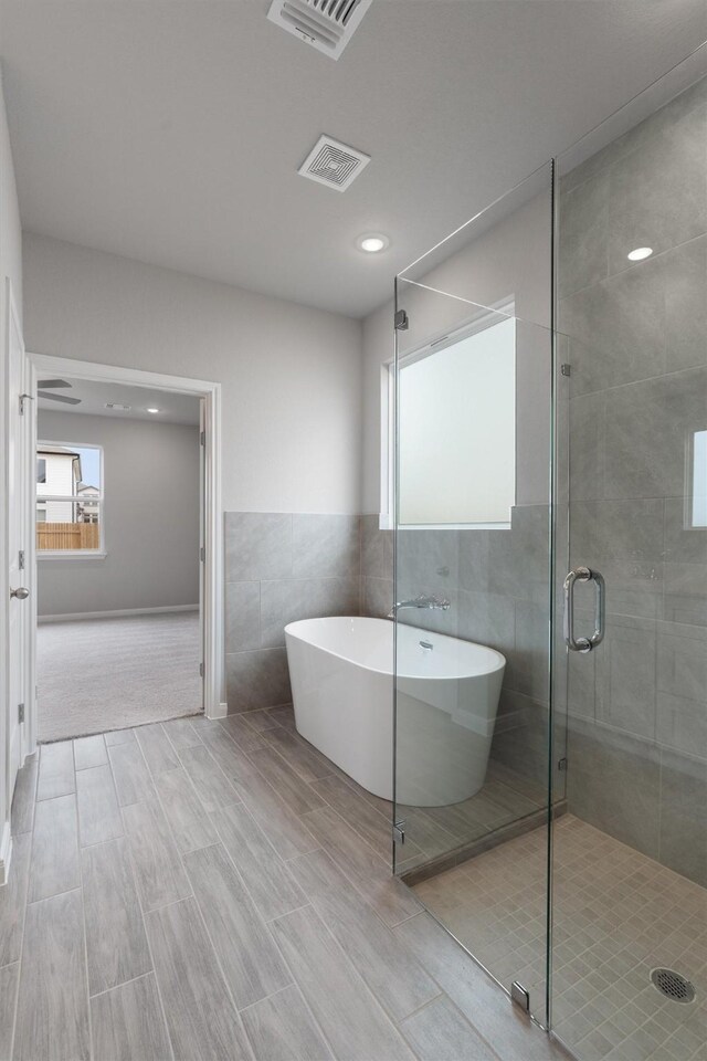 bathroom with independent shower and bath