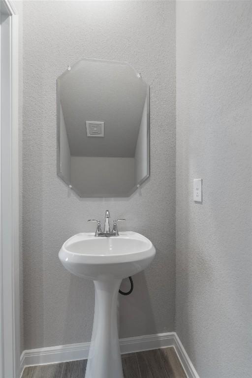 bathroom featuring wood-type flooring