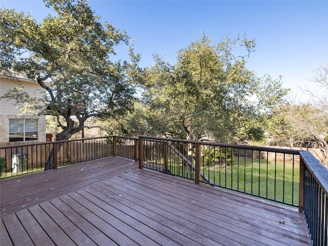 wooden deck featuring a yard