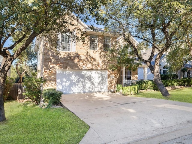 view of front of home with a front yard and a garage