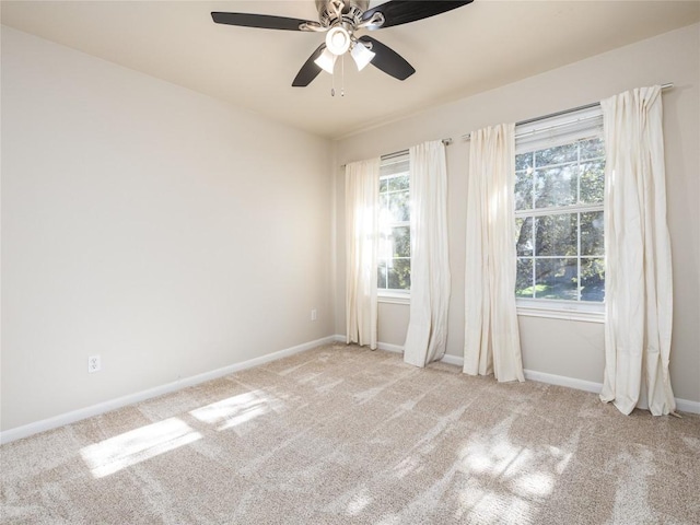 carpeted empty room with ceiling fan